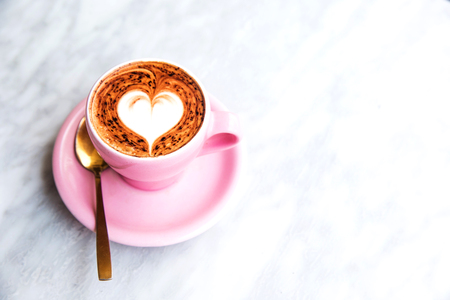 Cup of hot latte coffee on marble table backgroundの写真素材