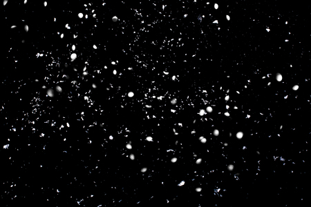 Blurred abstract silver sparkling background on black backdrop. Festive concept. Place for design.の写真素材