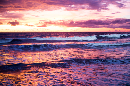 Beautiful sunset with yellow and violet sky at Bali, Indonesia. Nature concept.の写真素材