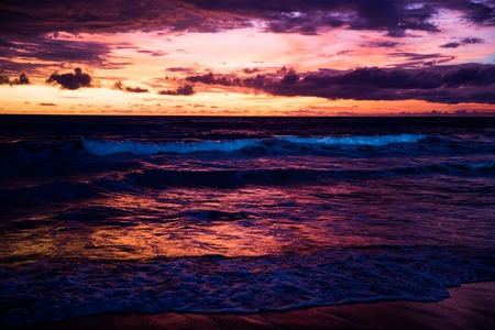 Beautiful sunset with yellow and violet sky at Bali, Indonesia.の写真素材