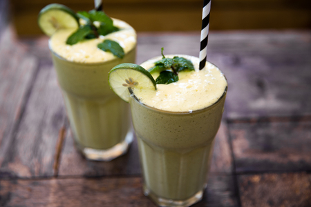Morning healthy breakfast smoothie drink made of super foods, fruits, mint.の写真素材