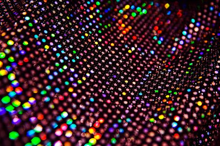 Colorful sparkling background of festive material with wavy folds. Party concept. Selective focus.の写真素材