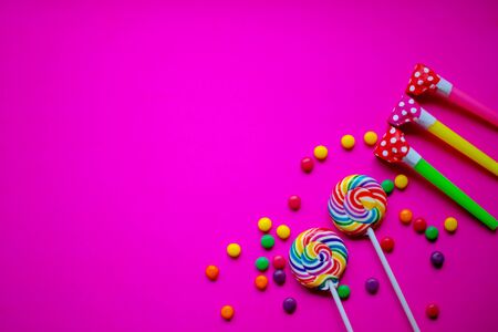 Colorful birthday party flat lay background with copyspace. Neon backdrop.の写真素材