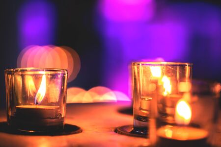 Some candles in a row in spa zone for relaxing time. It is late night.の写真素材