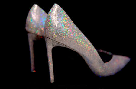 Sparkling elegant high-heeled shoes on black background.の写真素材