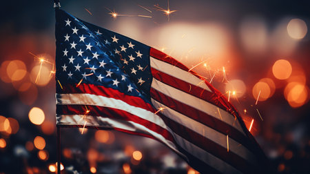 USA flag with colorful blurred fireworks background, independence day or veteran day celebrationの素材