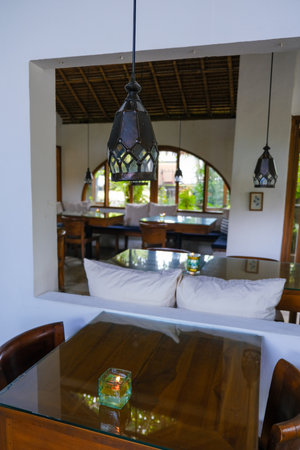 Rustic Dining Space with Traditional Lanterns and Garden Viewの写真素材