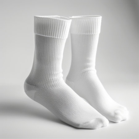 A studio shot of classic white socks, meticulously showcased on a white background for a clean and timeless look.の素材