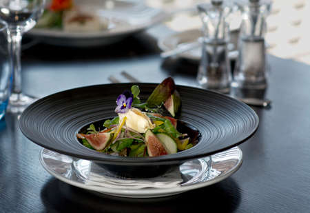 Beautiful restaurant dishes, Green fig saladの写真素材