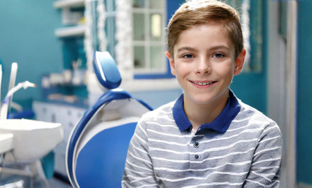 Portrait of a smiling boy in the dentist's office. Focus on the boyの素材
