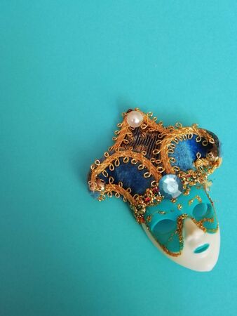 Venetian mask isolated on a blue background.の写真素材