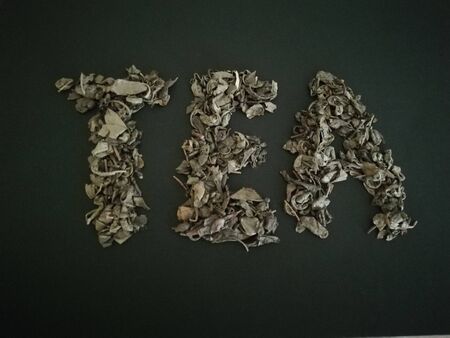 The word tea is presented from the tea itself.Green tea.の写真素材