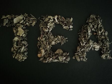 The word tea is presented from the tea itself.Green tea.の写真素材