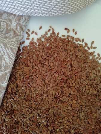 Flax seeds on white background, vintage color toneの写真素材