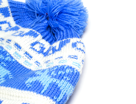 blue knitted baby hat on an isolated background