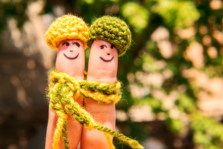 Drawn of finger. Men  in warm clothes. Family. Relationship. Love. Datingの写真素材