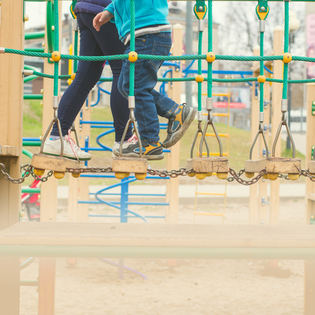 children run around the buildings on the Playgroundの写真素材