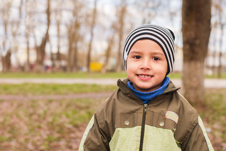 boy 4 years old in a striped hat posingの写真素材