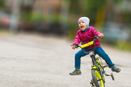 emotional boy learning to ride a bikeの写真素材