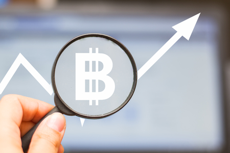 magnifier on the background of the monitor. Growth chart. Business conceptの写真素材