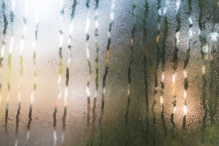flowed paths of moisture on the misted glassの写真素材