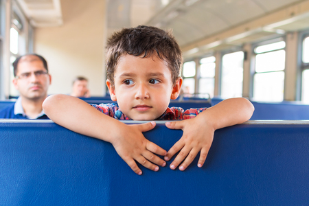 boy with his dad riding on the trainの写真素材