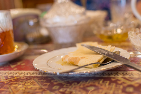 Breakfast on the table. Empty plates on the table. Tea half drunkの写真素材