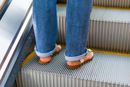 pedestrian on the escalator in underground passageの写真素材