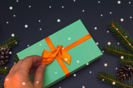 christmas inspiration. Unties the ribbon on the gift boxの写真素材