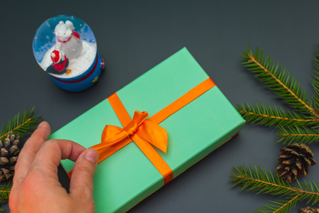 New year inspiration. Unties the ribbon on the gift boxの写真素材