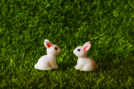 two figures Bunny on the grass. Happy Easter conceptの写真素材
