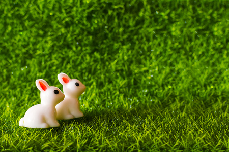 two figures Bunny on the grass. Happy Easter conceptの写真素材