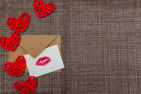 Kraft envelope, hearts and card with a lip print. the concept of Valentine's dayの写真素材