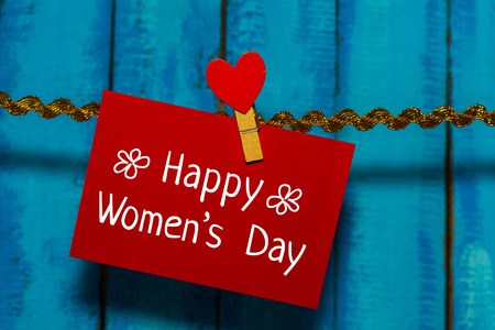 card hangs on a ribbon with congratulations.の写真素材