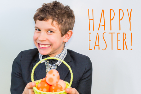 boy smiles and holds a basket of eggs. the concept of a happy Easter.