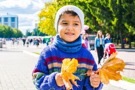 boy on a walk in the autumn Parkの写真素材