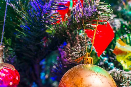Christmas decorations on the Christmas tree close-upの写真素材