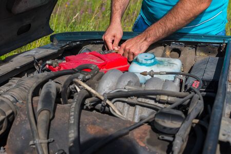open hood close-up. car repair on the roadの写真素材