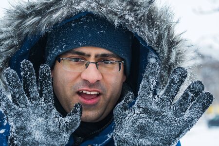 disgruntled man in winter outdoors