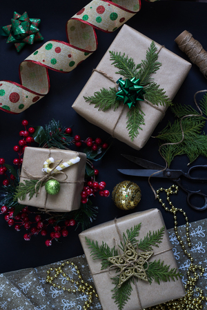 Preparing Christmas or New Year presents. Handmade decorative wrapped gifts. Holiday season, flat lay.の写真素材