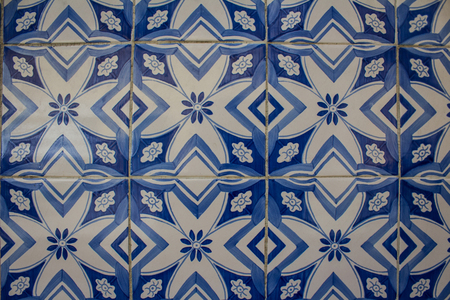 Detail of traditional Portuguese ceramic tiles wall from facade of old house. Exterior decoration....