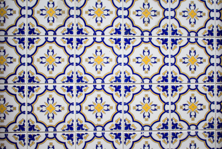 Detail of traditional Portuguese ceramic tiles wall from facade of old house. Exterior decoration....