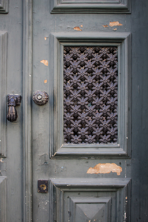 Beautiful old wooden decorated door in Porto, Portugal. Vintage style. Close upの写真素材