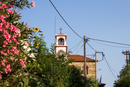 Beautiful flowers in front of the church on Ammouliani island in Greece. Travel destination conceptの写真素材