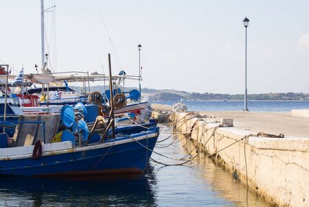 Small fishing boats in harbor Ammouliani, small island in Greeceの写真素材