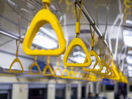 Handle on ceiling of bus trainの写真素材
