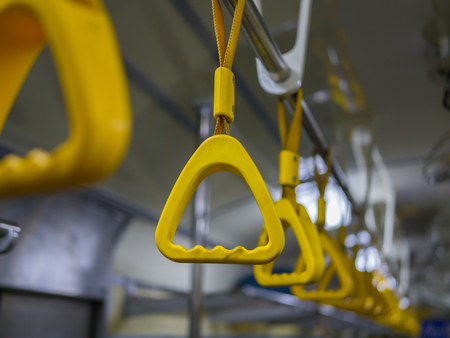 Handle on ceiling of bus trainの写真素材