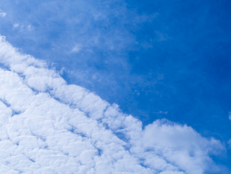 Blue sky with white cloud background.