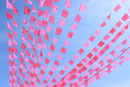 Typical Mexican street decoration with two-color confetti that is used in traditional festivalsの写真素材