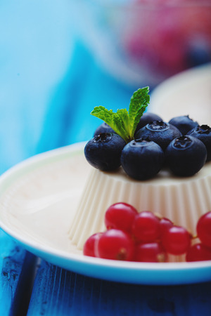 Vanilla panna cotta with fresh berriesの写真素材